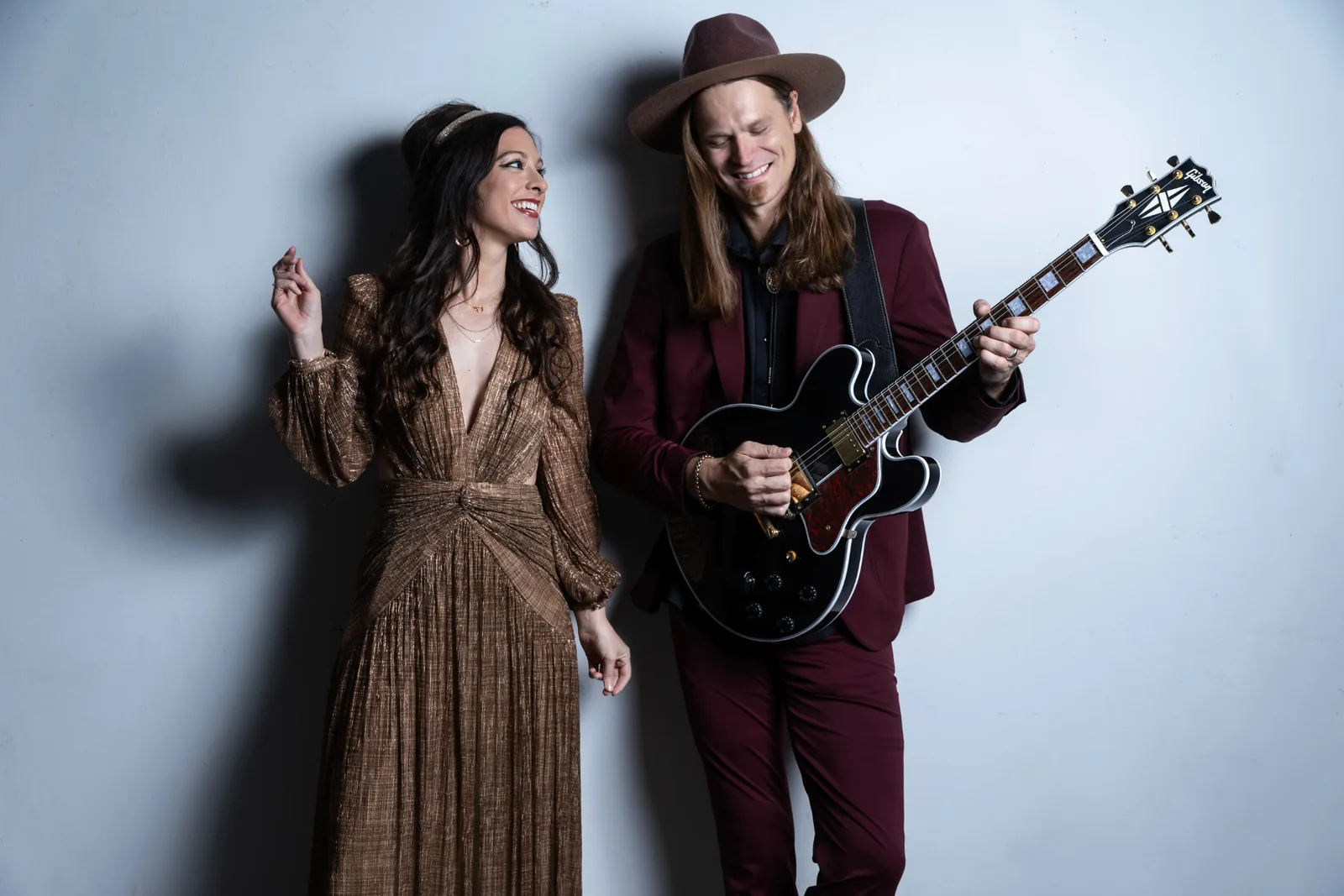 The Imaginaries duo standing together with a guitar